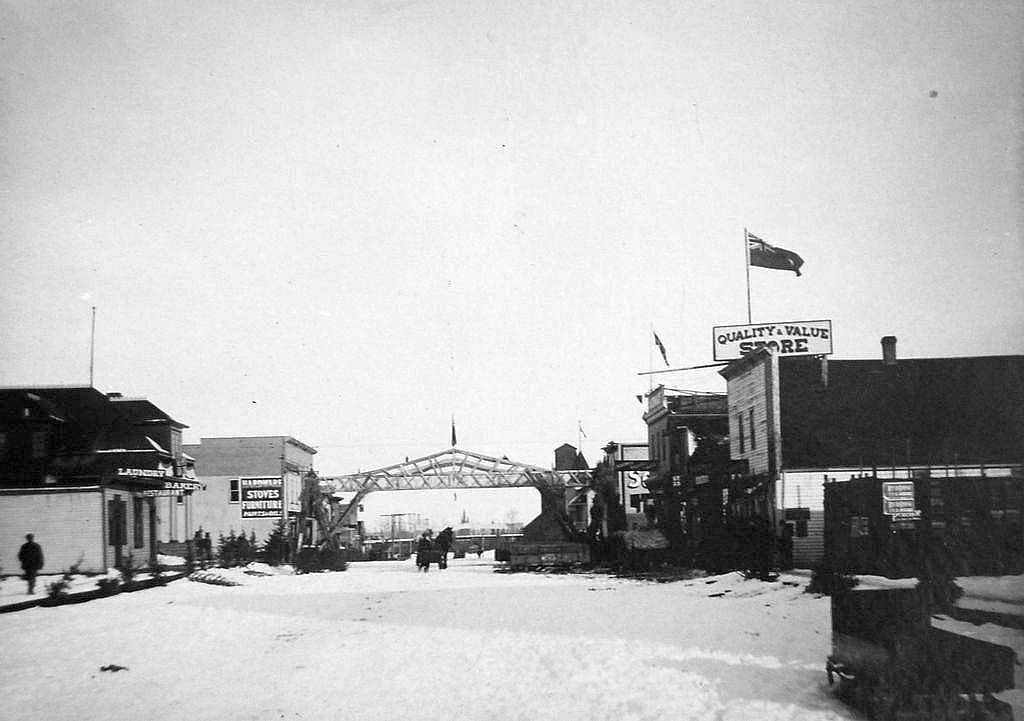 Historic black-and-white photo of the main street in Stony Plain, Alberta, in winter around 1912